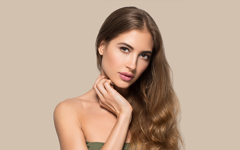 female model gazing with a slightly tilted face to the camera