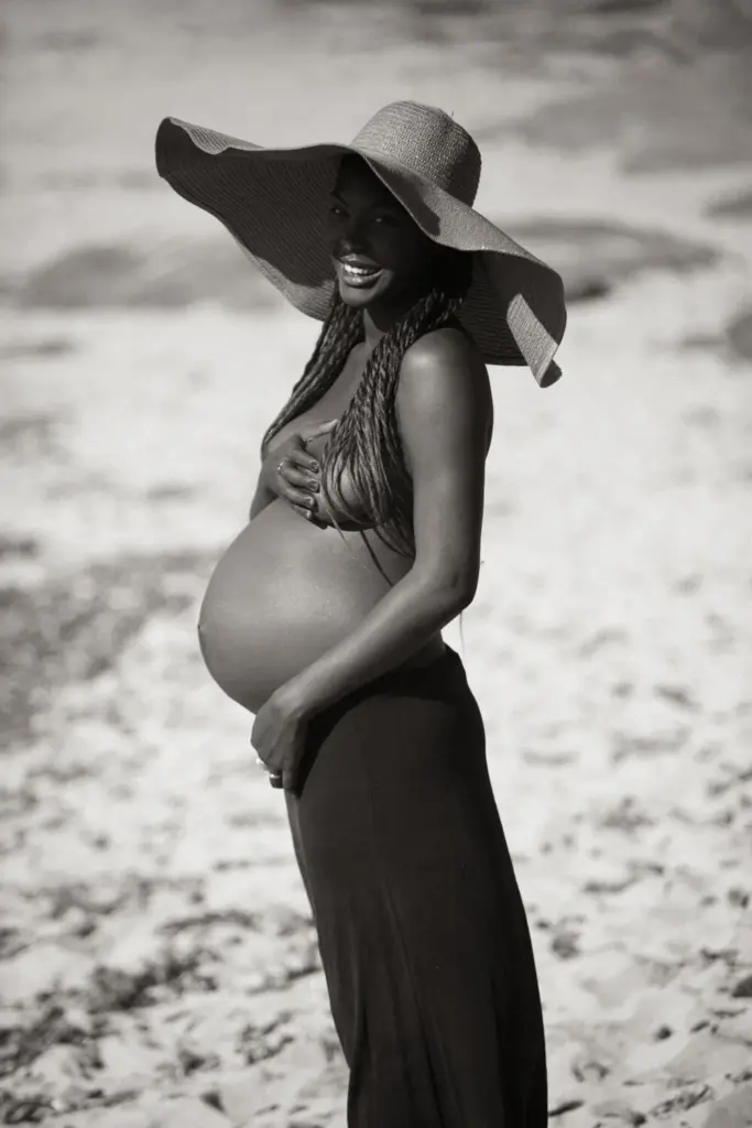 Standing beach maternity pose