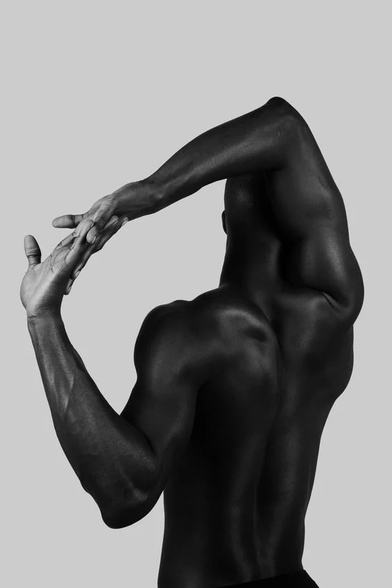 Male boudoir photo idea of flexing pose