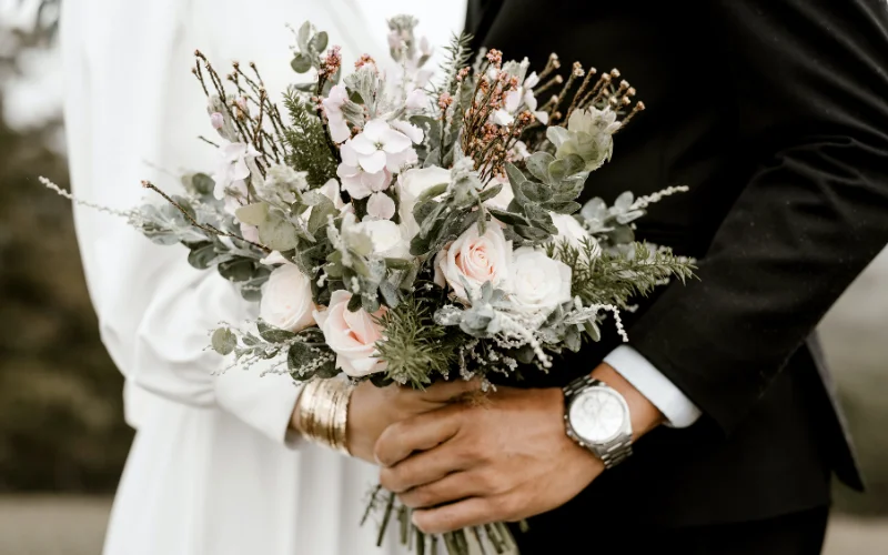couple having a bouquet in their hands