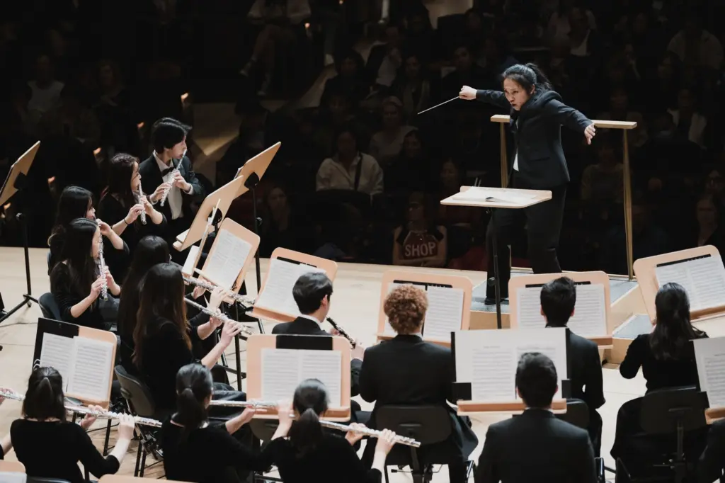 performing arts photographer clicking Women leading a choir 