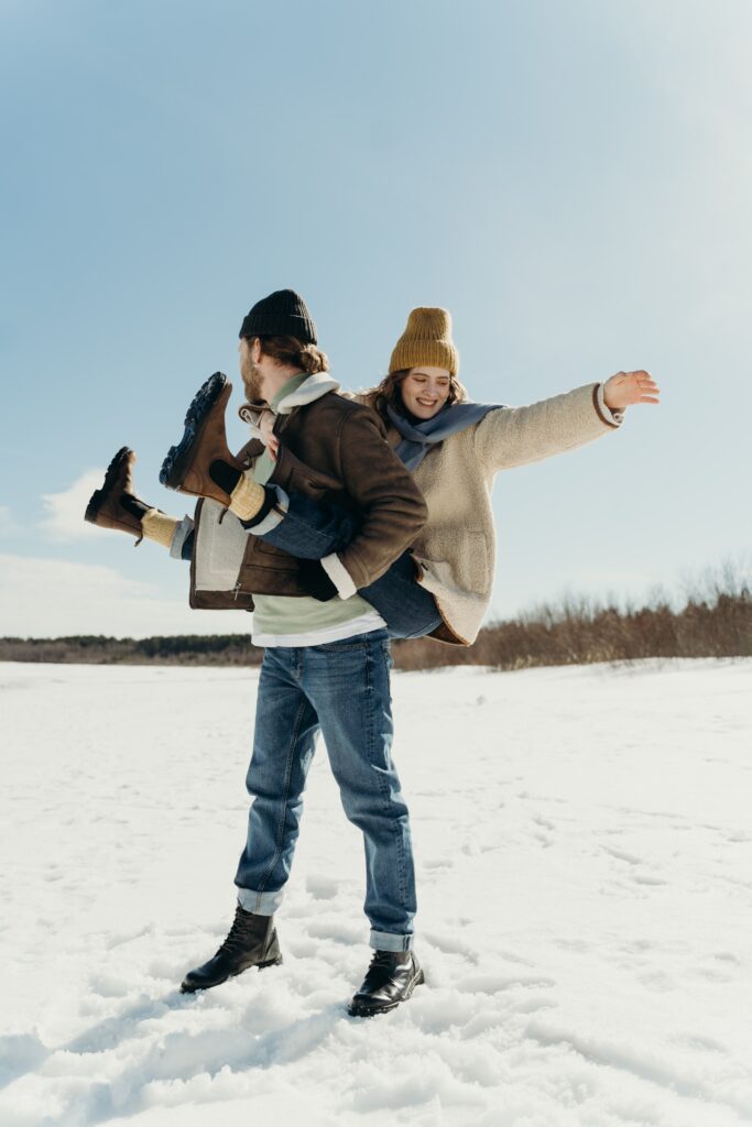 Man carrying her woman