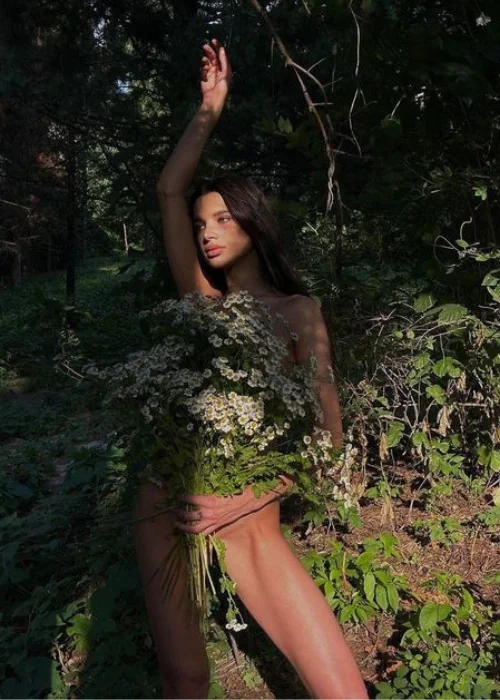 nude in nature women behind the tree