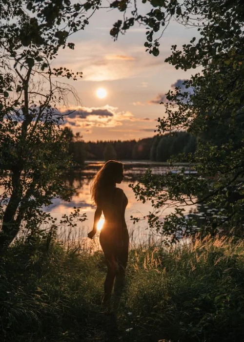 silhouette of a woman posing in nature