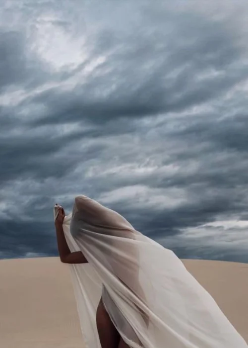 woman posing nude in the desert