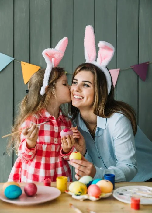 photo of family painting eggs, Easter family photography, Easter family picture ideas, Easter-themed family photos