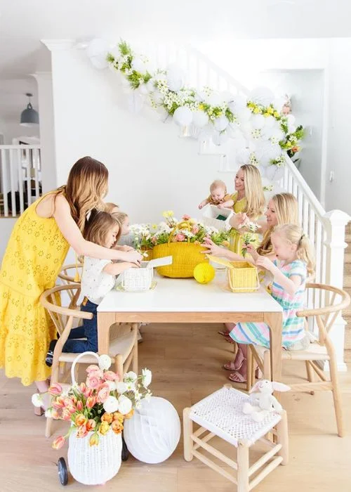 family arranging spring flowers, Easter outdoor family photos, Easter family studio session
