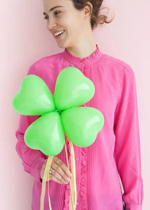 capture photo with a large four leaf clover