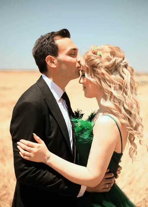 The forehead kiss pose